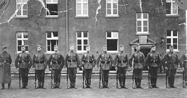 draftee-09.jpg - The photographs in the album were basically in time line order. After introducing the major personalities and location of his early military service, the theme shifts to the men of his training squad and some of their activities. Here, the squad turns out in front of the barracks. Compulsory military service was instituted in May 1935 as the Germans began to openly disregard the peace treaties signed at the end of WW 1. For an infantryman in the pre war years, this training was the responsibility of his gaining unit. 