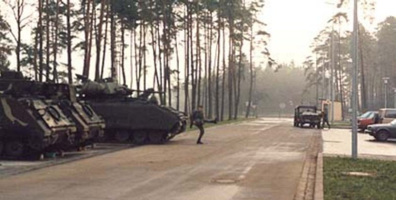 apr0203_TS7.jpg - Todd Stach - E Troop - Camp Lee - 1986 - Paul Hansen has the " duck walk " going on by the Reaction force.