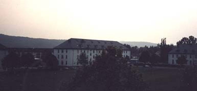 apr1303_TS15.jpg - Todd Stach - E Troop - Daley - 1985 - Sun sets of Daley Barracks, looking across Parade Field.
