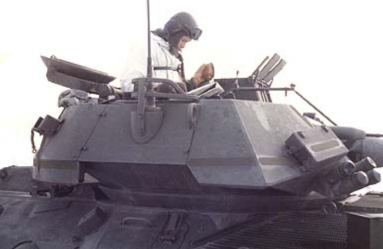 apr1303_TS47.jpg - Todd Stach - E Troop - FTX - 1986 - SGT Bennett checks out his map.