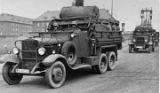 Trucks departing Manteuffel Kaserne. Stefanowicz: the trucks may be part of a heavy machinegun section, mortar section or admin / supply, difficult to tell. Note that the road is not yet paved with brick and the stone monolith that carried the title "Manteuffel Kaserne" is not completed, it can be seen with scaffolds and banners in the background. Trucks departing Manteuffel Kaserne. Stefanowicz: the trucks may be part of a heavy machinegun section, mortar section or admin / supply, difficult to tell. Note that the road is not yet paved with brick and the stone monolith that carried the title "Manteuffel Kaserne" is not completed, it can be seen with scaffolds and banners in the background.
